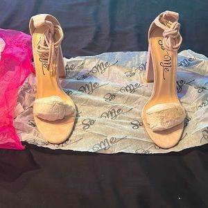 Beige Strappy open toe heels with lace front.